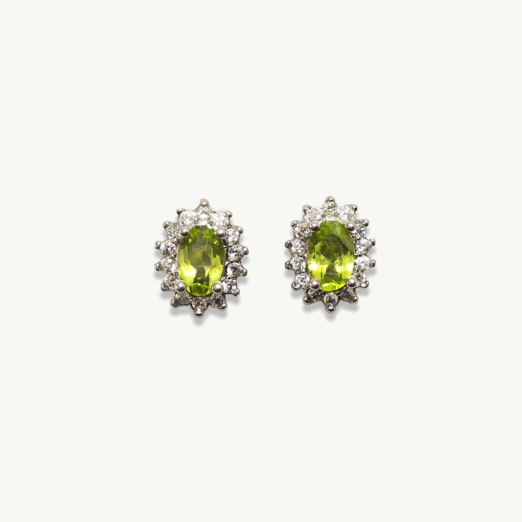 Peridot · Serenity & Renewal Stud Earrings Peridot Serenity & Renewal Stud Earrings in sterling silver with zirconia halo by Meruisa Crystal