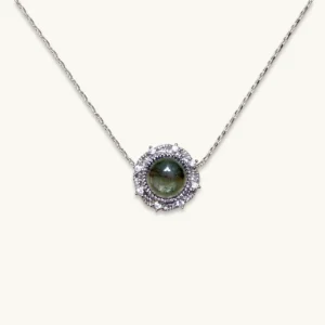 Green Phantom Quartz · Growth & Manifestation Pendant — silver plated pendant with micro‑pave diamond rays and natural green phantom quartz center by Meruisa Crystal