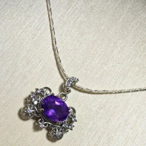 Cinderella's Wish Amethyst Pumpkin Carriage Pendant — natural 17.2mm brilliant‑cut Amethyst set in silver‑plated copper with lace filigree and micro‑pave diamonds by Meruisa Crystal