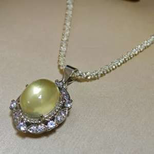 Citrine · Abundance Crown Pendant — 15mm natural honey-gold Citrine cabochon set in pave diamond halo by Meruisa Crystal