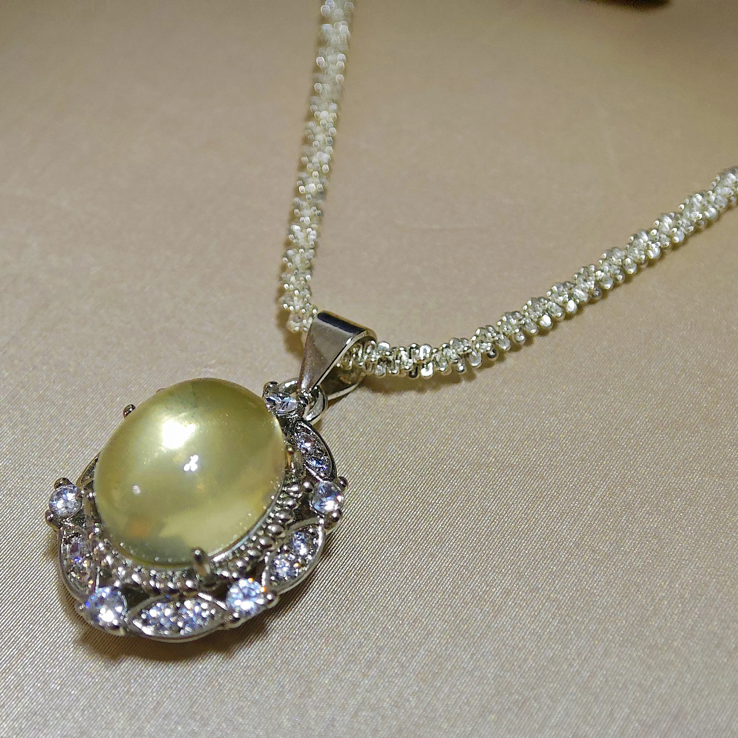 Citrine · Abundance Crown Pendant Citrine · Abundance Crown Pendant — 15mm natural honey-gold Citrine cabochon set in pave diamond halo by Meruisa Crystal