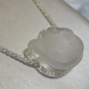 Clear Quartz · Ampification Hello Kitty Pendant — natural 23.9mm sculpted clear quartz with frosted finish and faceted details by Meruisa Crystal