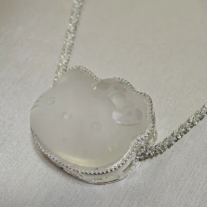 Clear Quartz · Ampification Hello Kitty Pendant — natural 23.9mm sculpted clear quartz with frosted finish and faceted details by Meruisa Crystal
