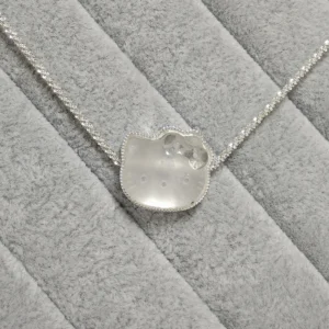 Clear Quartz · Ampification Hello Kitty Pendant — natural 23.9mm sculpted clear quartz with frosted finish and faceted details by Meruisa Crystal
