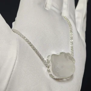 Clear Quartz · Ampification Hello Kitty Pendant — natural 23.9mm sculpted clear quartz with frosted finish and faceted details by Meruisa Crystal