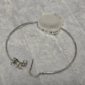 Clear Quartz · Ampification Hello Kitty Pendant — natural 23.9mm sculpted clear quartz with frosted finish and faceted details by Meruisa Crystal