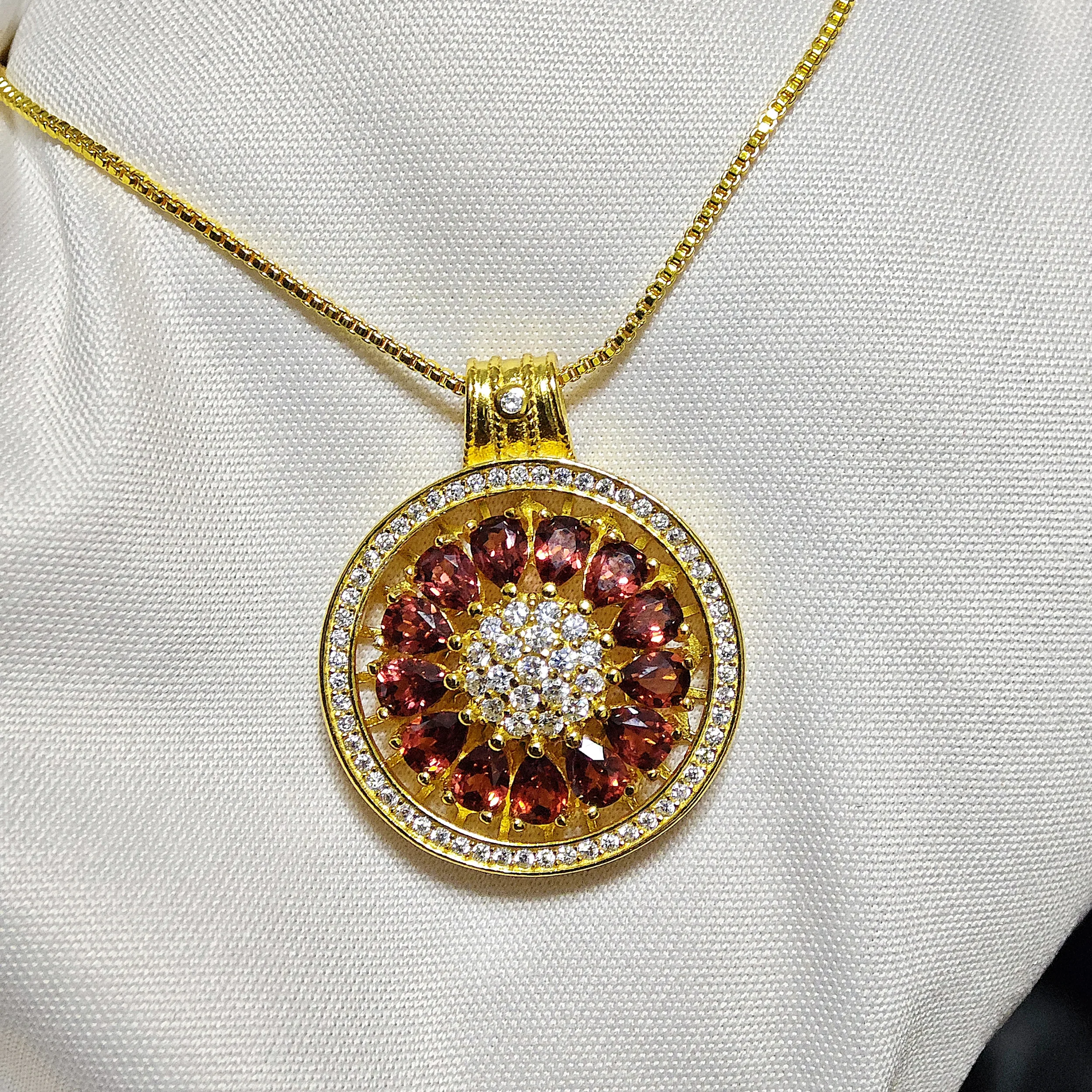 Garnet · Vitality & Guidance Compass Pendant Garnet Guidance Pendant — natural Garnet compass pendant with zirconia outer ring and pave crystal center by Meruisa Crystal