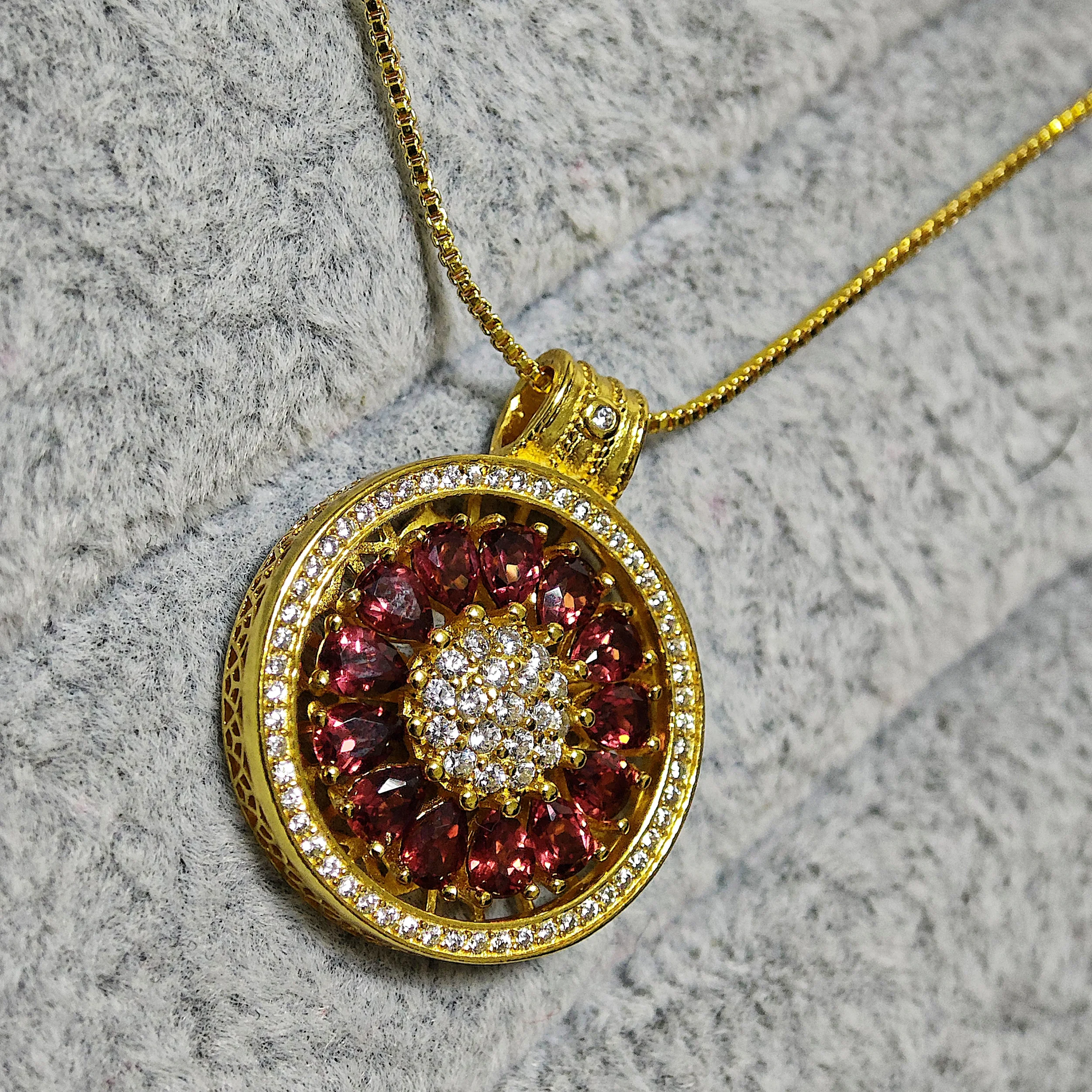 Garnet · Vitality & Guidance Compass Pendant Garnet Guidance Pendant — natural Garnet compass pendant with zirconia outer ring and pave crystal center by Meruisa Crystal