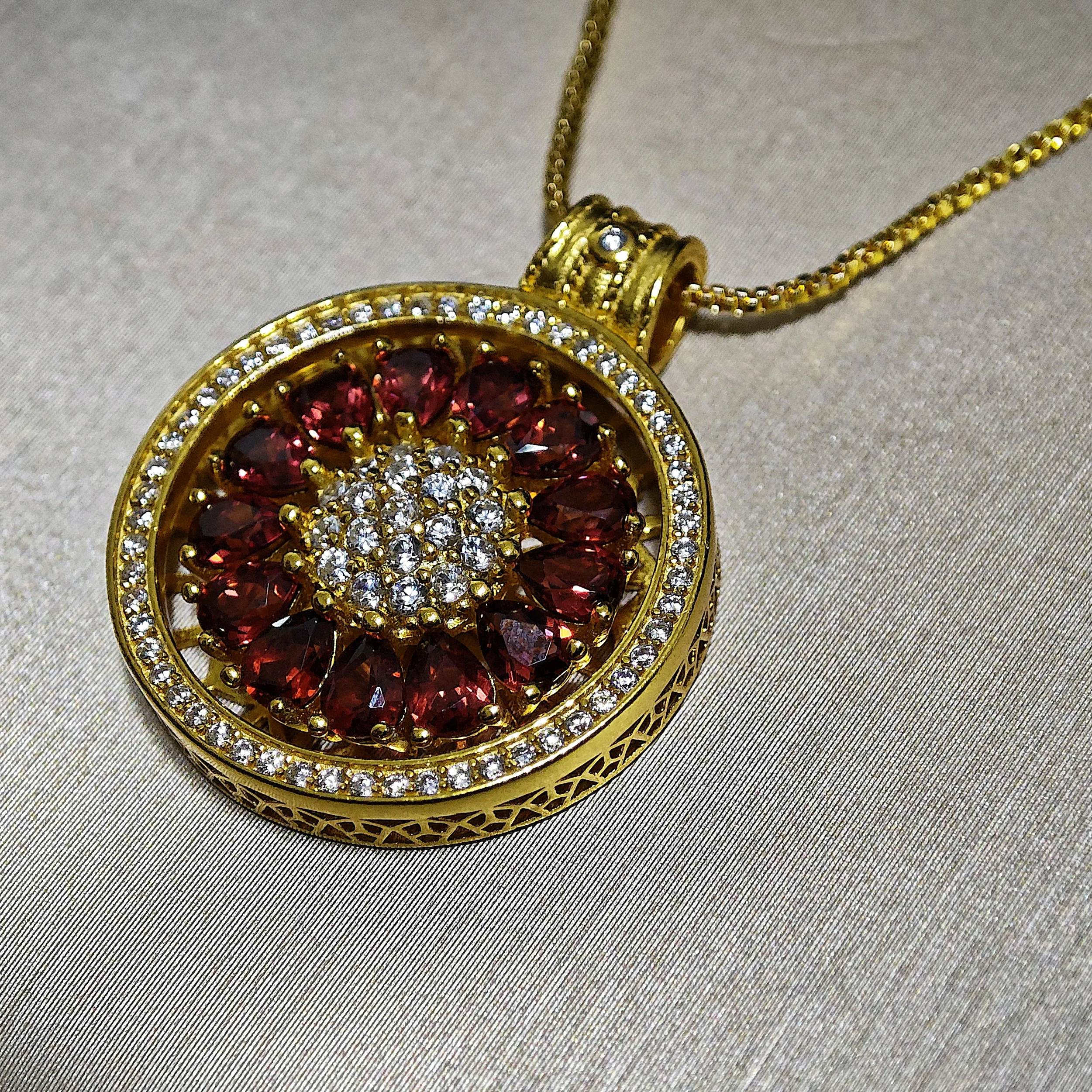 Garnet · Vitality & Guidance Compass Pendant Garnet Guidance Pendant — natural Garnet compass pendant with zirconia outer ring and pave crystal center by Meruisa Crystal
