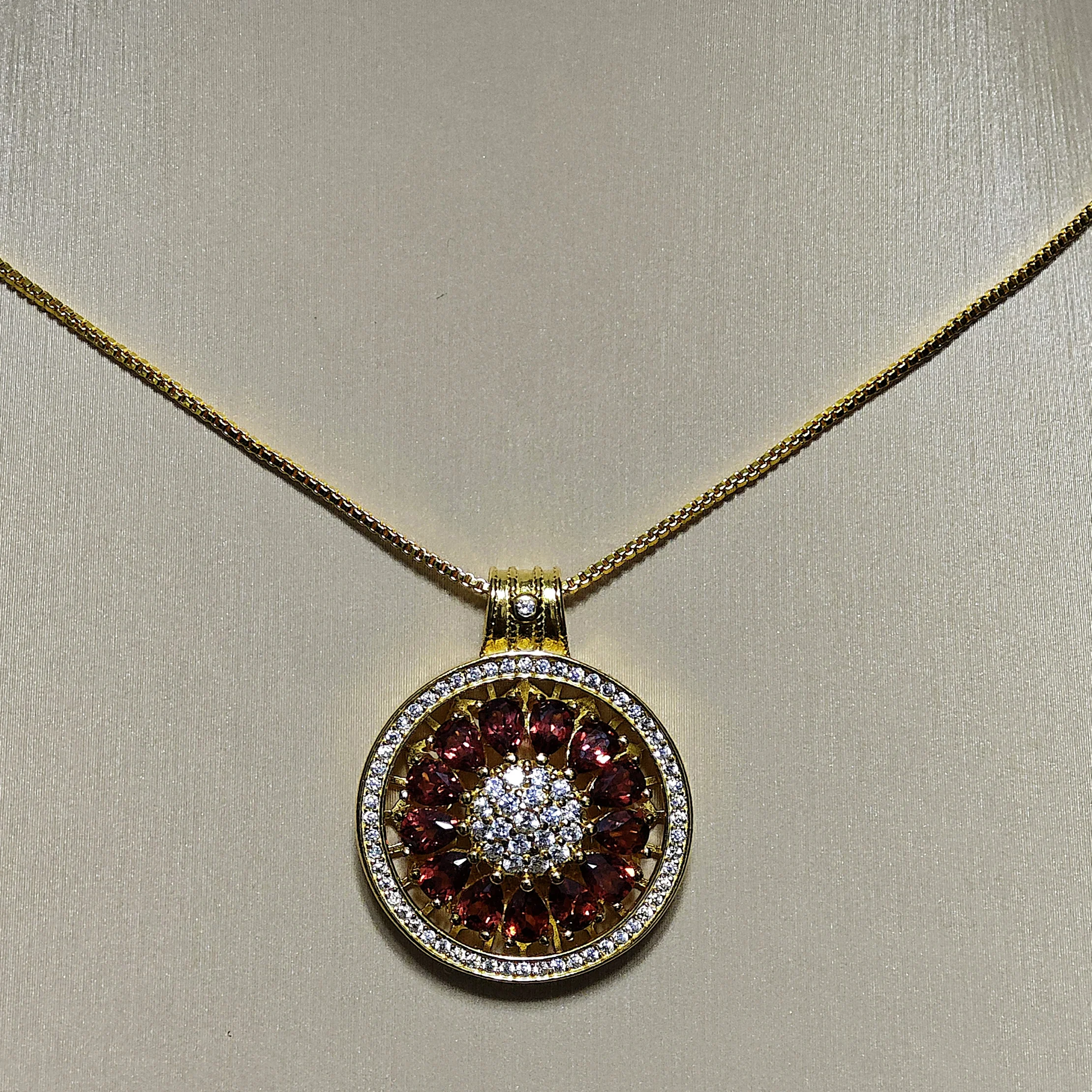 Garnet · Vitality & Guidance Compass Pendant Garnet Guidance Pendant — natural Garnet compass pendant with zirconia outer ring and pave crystal center by Meruisa Crystal