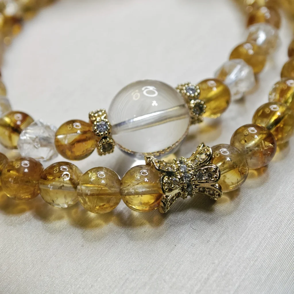 Golden Citrine & Clear Quartz · Success Double Wrap Bracelet Double Wrap Golden Citrine & Clear Quartz Bracelet — double‑wrap bracelet with 11.7mm Clear Quartz crown, 6.3mm Golden Citrine beads, and faceted Clear Quartz accents by Meruisa Crystal