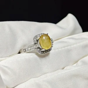 Golden Light Rutilated Quartz Prosperity Ring — natural cabochon Golden Rutilated Quartz with golden rutile strands set in sterling silver with square-cut accent stones by Meruisa Crystal