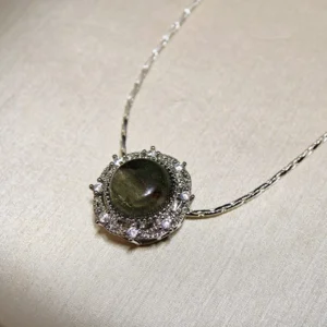 Green Phantom Quartz · Growth & Manifestation Pendant — silver plated pendant with micro‑pave diamond rays and natural green phantom quartz center by Meruisa Crystal