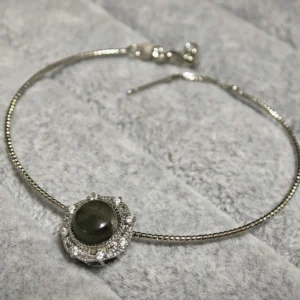 Green Phantom Quartz · Growth & Manifestation Pendant — silver plated pendant with micro‑pave diamond rays and natural green phantom quartz center by Meruisa Crystal