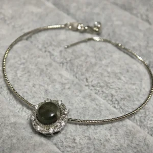 Green Phantom Quartz · Growth & Manifestation Pendant — silver plated pendant with micro‑pave diamond rays and natural green phantom quartz center by Meruisa Crystal