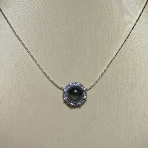 Green Phantom Quartz · Growth & Manifestation Pendant — silver plated pendant with micro‑pave diamond rays and natural green phantom quartz center by Meruisa Crystal