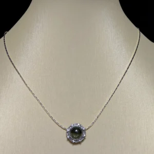 Green Phantom Quartz · Growth & Manifestation Pendant — silver plated pendant with micro‑pave diamond rays and natural green phantom quartz center by Meruisa Crystal