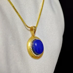 Golden Sands Lapis Lazuli Oval Pendant — gold-plated silver oval pendant with golden sand textured rim, micro-pave diamond halo, and natural lapis lazuli center by Meruisa Crystal