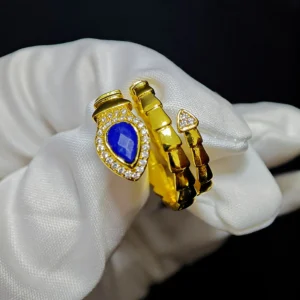Lapis Lazuli · Intuition & Protection Serpent Ring — waterdrop-cut natural Lapis Lazuli in gold-plated copper serpent setting with pave diamond head and tail accents by Meruisa Crystal