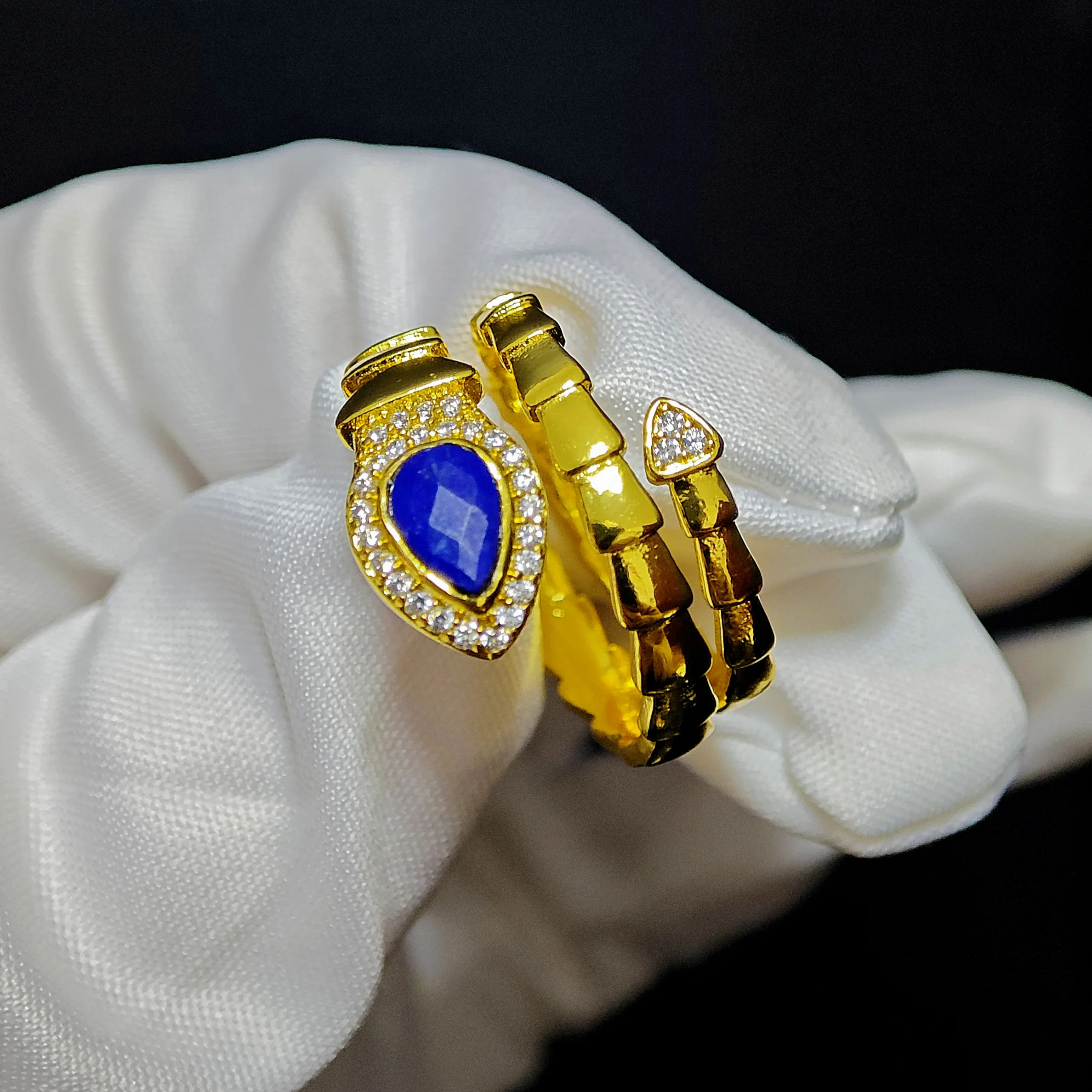 Lapis Lazuli · Intuition & Protection Serpent Ring Lapis Lazuli · Intuition & Protection Serpent Ring — waterdrop-cut natural Lapis Lazuli in gold-plated copper serpent setting with pave diamond head and tail accents by Meruisa Crystal