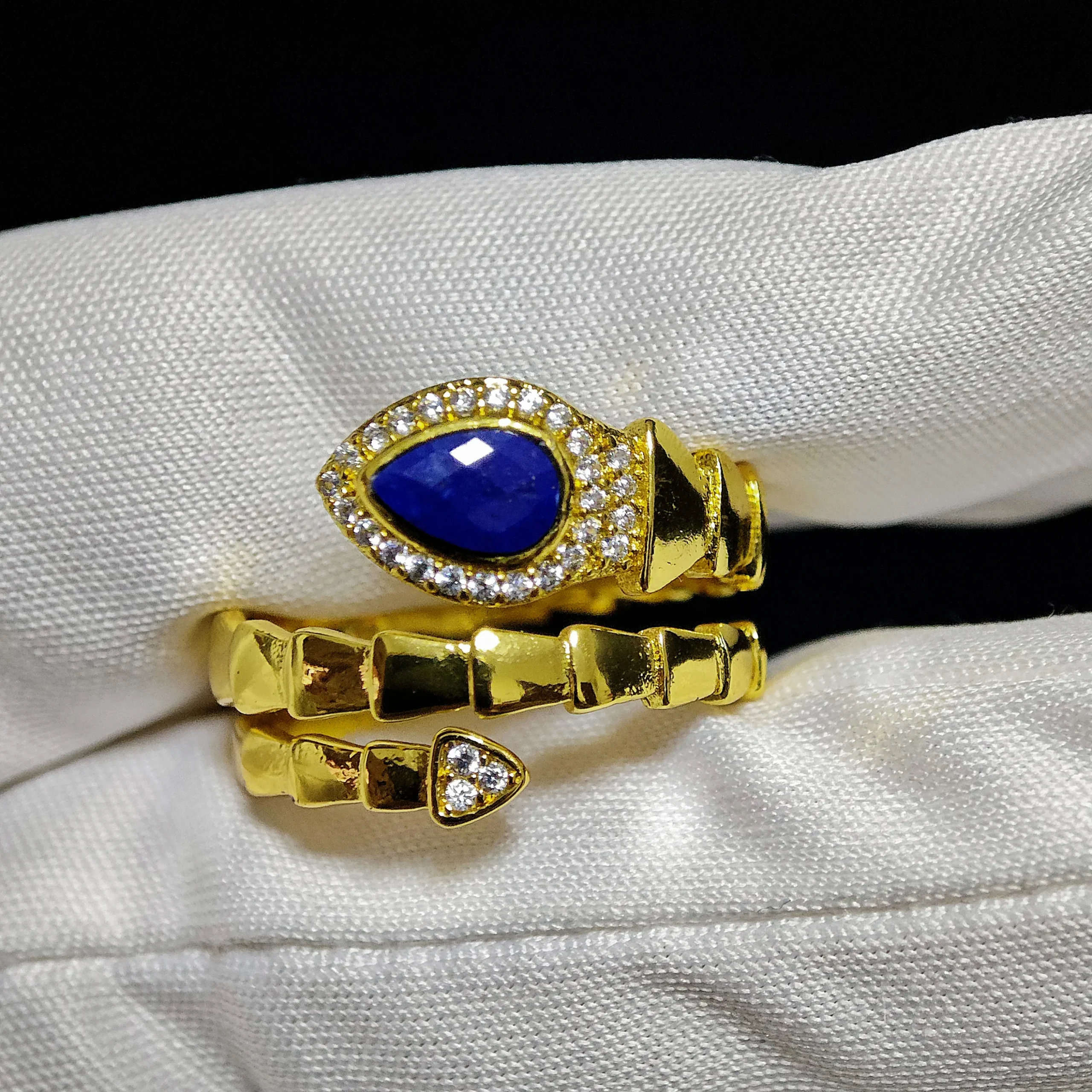 Lapis Lazuli · Intuition & Protection Serpent Ring Lapis Lazuli · Intuition & Protection Serpent Ring — waterdrop-cut natural Lapis Lazuli in gold-plated copper serpent setting with pave diamond head and tail accents by Meruisa Crystal