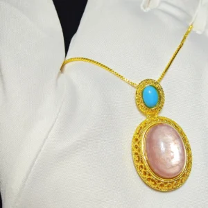 Lepidolite · Serenity Blue Apatite Pendant — 19.7mm natural Lepidolite cabochon in openwork gold-tone frame with Blue Apatite accent by Meruisa Crystal