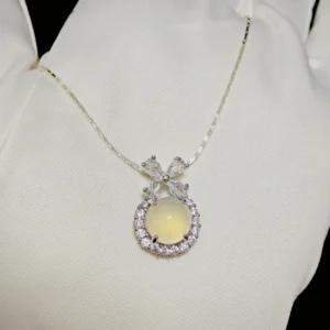 Milky Chalcedony Pendant — natural milky chalcedony with zirconia bow and halo by Meruisa Crystal