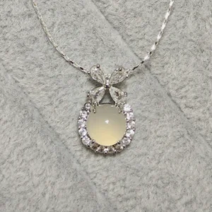 Milky Chalcedony Pendant — natural milky chalcedony with zirconia bow and halo by Meruisa Crystal
