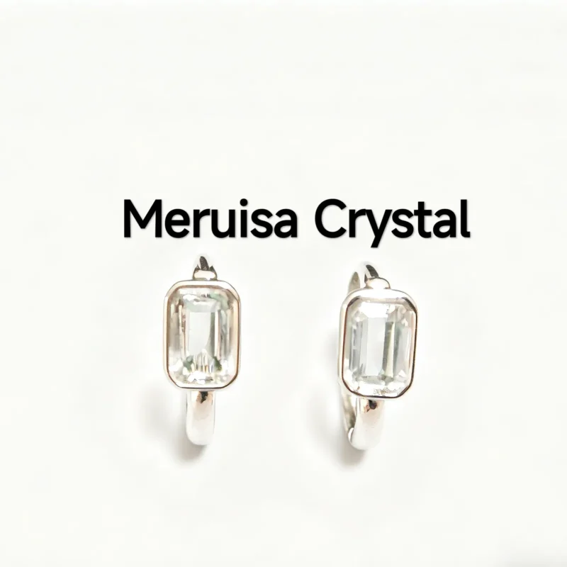 Sleek rectangular hoop earrings featuring a natural clear quartz, set in solid sterling silver by Meruisa Crystal