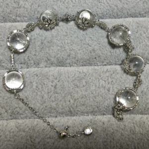 Clear Quartz Healer & Clarity Snowflake Bracelet — natural quartz spheres and vintage snowflake details set in silver-plated copper by Meruisa Crystal