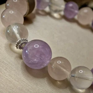 Trio of Light Bracelet — 10.9mm beaded bracelet with natural Milky Quartz, Rose Quartz, and Lavender Amethyst, featuring a 13.1mm Lavender Amethyst crown bead by Meruisa Crystal