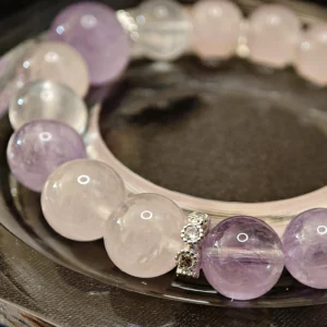 Trio of Light Bracelet — 10.9mm beaded bracelet with natural Milky Quartz, Rose Quartz, and Lavender Amethyst, featuring a 13.1mm Lavender Amethyst crown bead by Meruisa Crystal