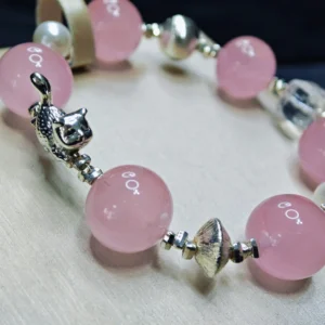 Whisker & Blush Rose Quartz Bracelet — 14.4mm natural rose quartz beads with shell pearl accents, square clear quartz, and silver cat charm by Meruisa Crystal