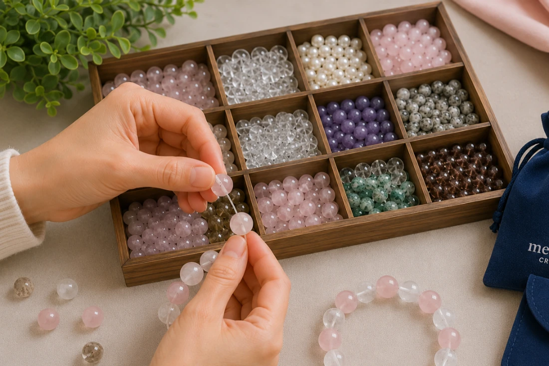 Crystal Bead Size Guide Jewelry artisan selecting 14mm White Azeztulite and Rose Quartz beads for a handcrafted crystal bracelet.
